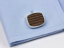 image displaying the lambeau field cuff link on a blue shirt sleeve.