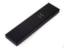 image displaying black tokens & icons watch box packaging.