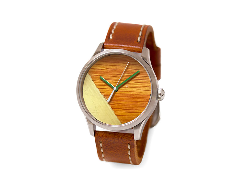 image displaying brown parquet with yellow stripe boston garden watch with brown leather strap.