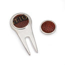 golf divot tool and ball marker with carolina panthers football material inset on a white background.