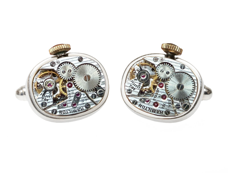 image displaying a pair of hamilton watch movement cuff links with a crown.