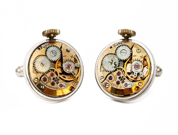 Image displaying a pair of circular Elgin watch movement cufflinks with a crown.