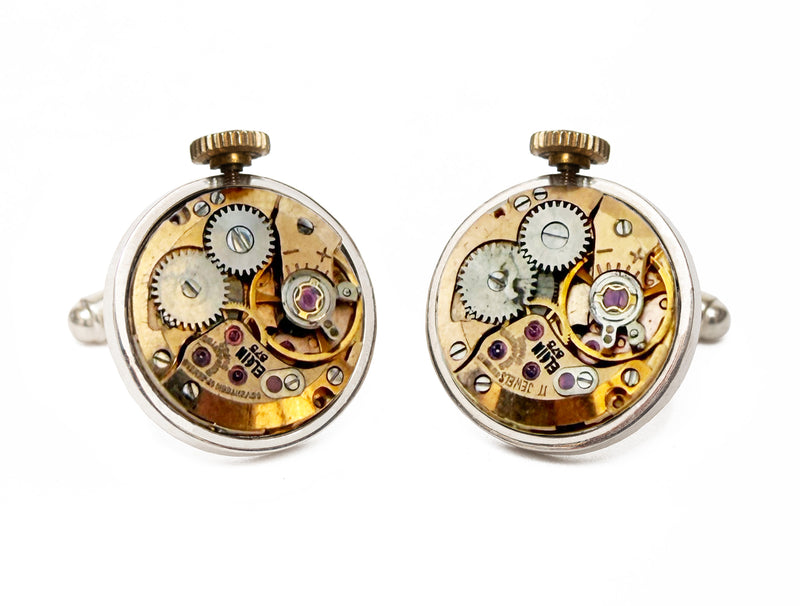 image displaying a pair of circular elgin watch movement cufflinks with a crown.