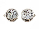 image displaying a pair of circular tissot watch movement cufflinks with no crowns.