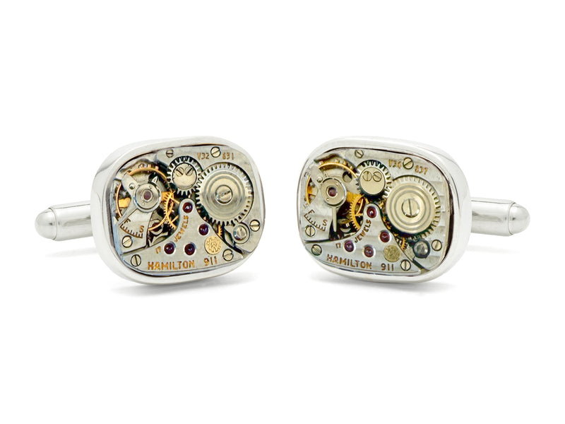image displaying a pair of hamilton watch movement cufflinks without crowns.