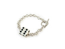 silver bracelet with a dice charm on a white background