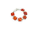 sterling silver bracelet featuring six orange die faces as charms.