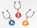 image displaying group of new york subway route indicator key rings