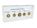 image displaying lucite block featuring five vintage american city transit tokens from new york, chicago, boston, los angeles, and san francisco. back view.