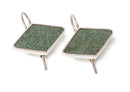 image displaying a pair of diamond-shaped frank lloyd wright earrings made from the copper flashing of the graycliff estate roof.