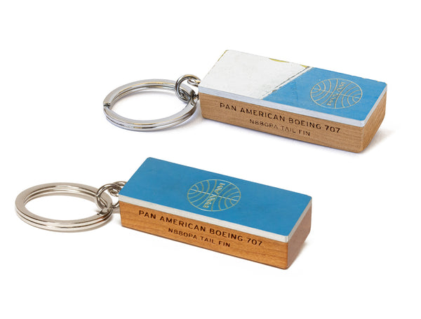 Image displaying blue and blue and white Pan Am 707 key rings