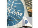 image displaying pan am n880pa 707 tailfin in warehouse