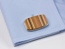 image displaying tennis racquet cuff links on shirt cuff