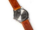 image displaying the engraved backside of the lambeau field watch, which reads, "lambeau field. wood seat removed in 1969."