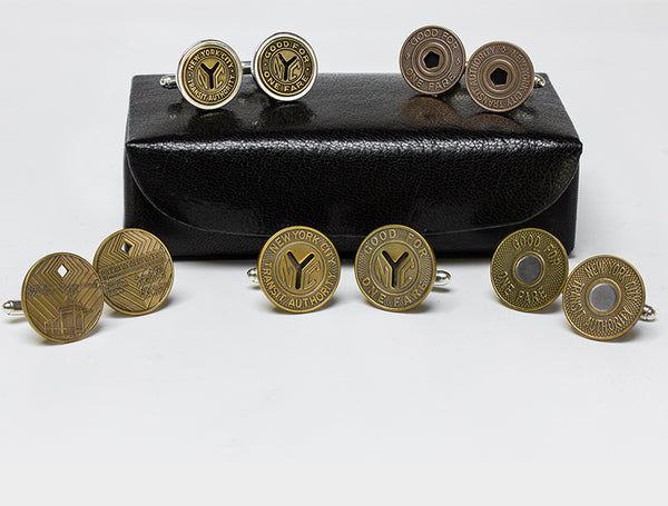 Image displaying group of New York Transit Token cuff links with leather case