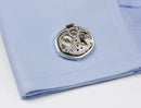 image displaying vintage watch movement cuff links on shirt cuff